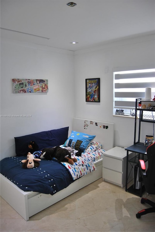 bedroom with crown molding