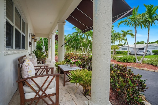 view of patio featuring a porch