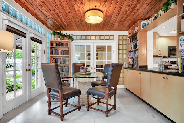 dining area with wood ceiling and french doors