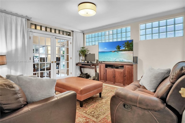 living room with french doors and crown molding