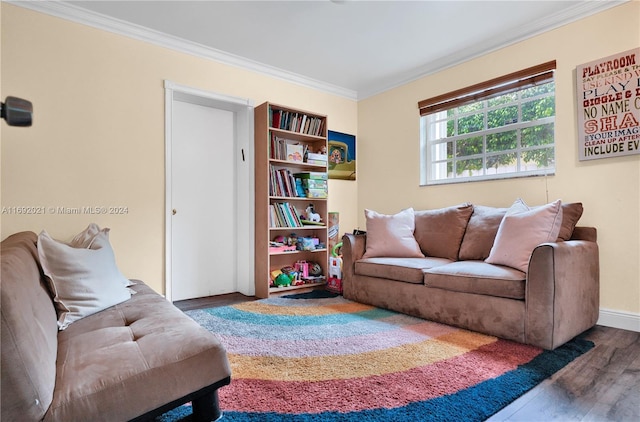 living room featuring dark hardwood / wood-style flooring and crown molding