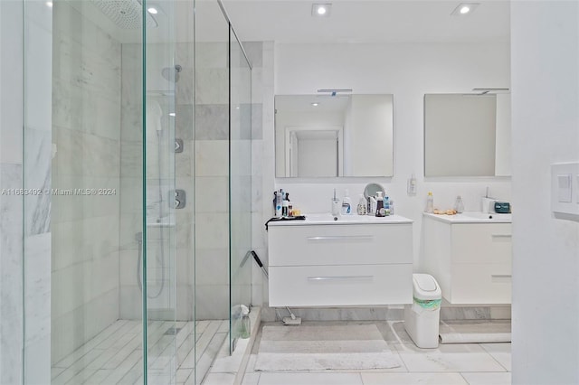 bathroom featuring vanity, walk in shower, and tile patterned flooring