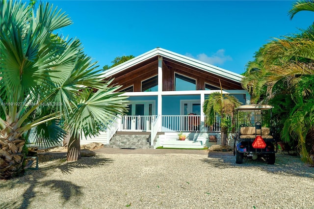 view of front of property featuring a porch and french doors