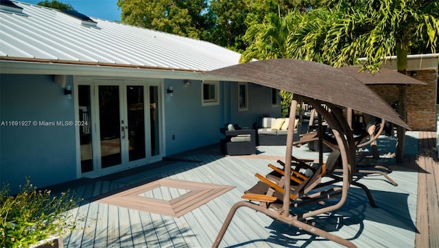 deck featuring an outdoor hangout area and french doors