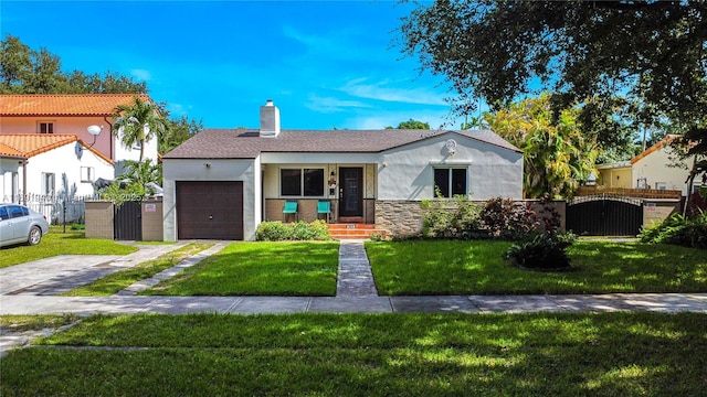 view of front of property with a garage and a front yard