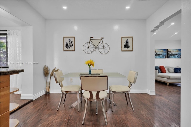 dining room with dark wood-type flooring