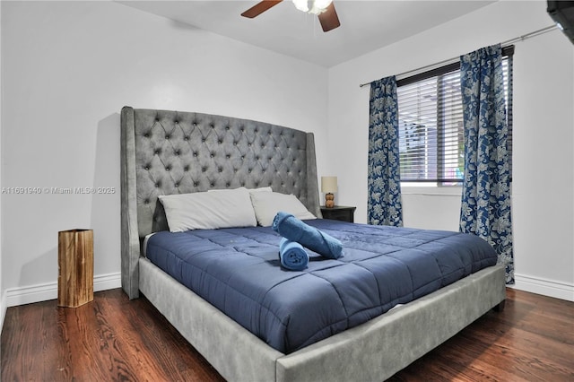 bedroom with ceiling fan and dark hardwood / wood-style flooring