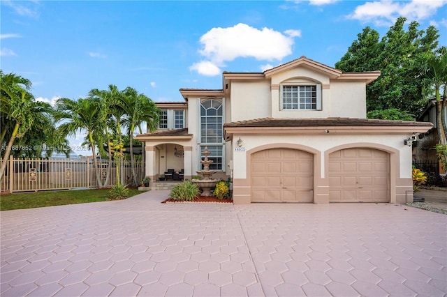 mediterranean / spanish-style house with a garage