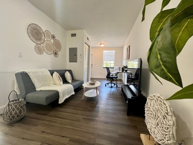 living room featuring electric panel and dark hardwood / wood-style flooring