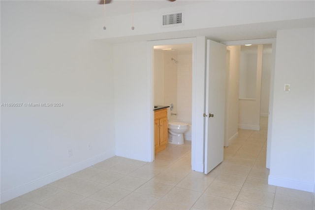 hall with light tile patterned flooring