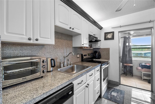 kitchen with white cabinetry, appliances with stainless steel finishes, sink, and a textured ceiling