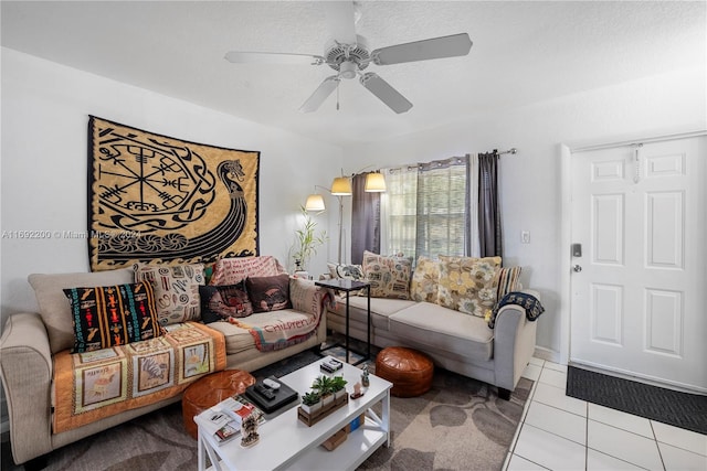 tiled living room featuring a textured ceiling and ceiling fan