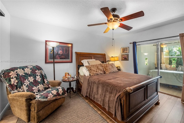 bedroom featuring wood-type flooring and ceiling fan