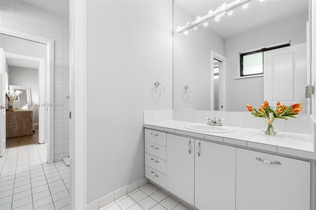 bathroom featuring vanity and tile patterned flooring