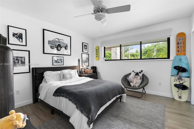 bedroom with hardwood / wood-style floors and ceiling fan