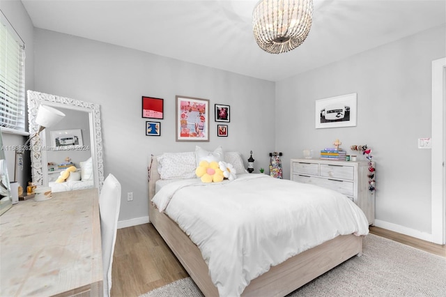 bedroom with light hardwood / wood-style flooring