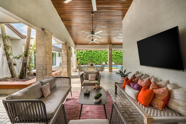 view of patio / terrace with ceiling fan and an outdoor living space