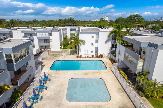 view of swimming pool with a patio area