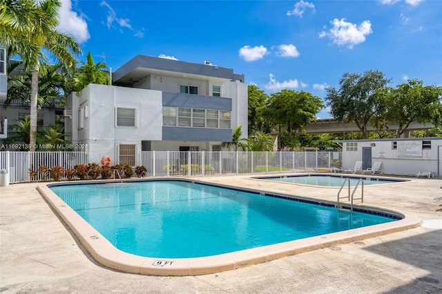 view of swimming pool featuring a patio area