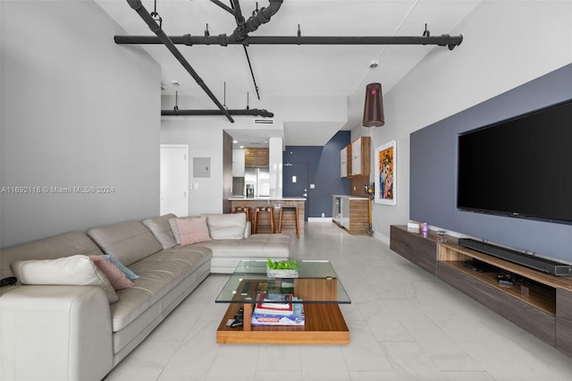 living room with a towering ceiling