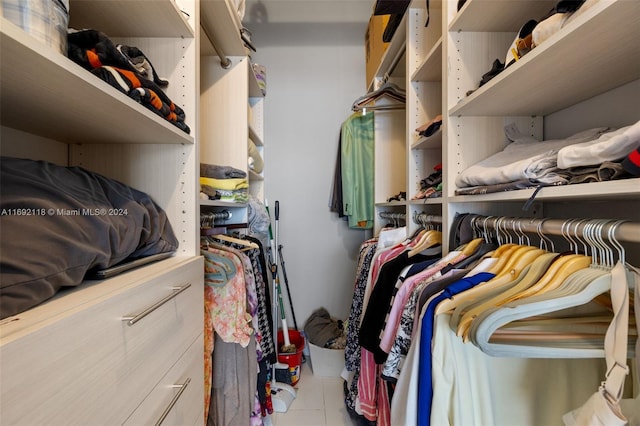 spacious closet featuring light tile patterned floors