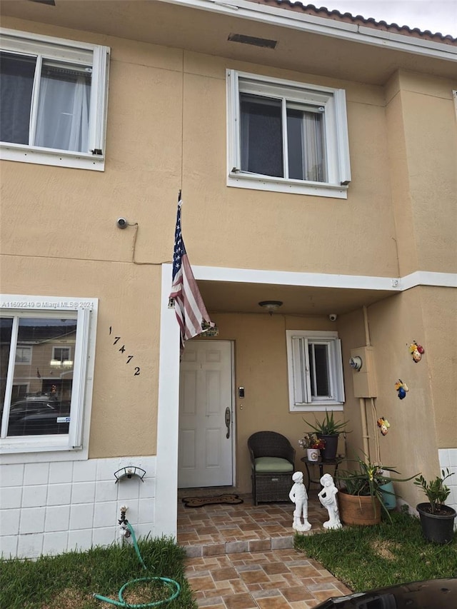 doorway to property with a patio