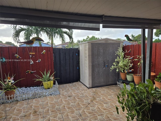 view of patio / terrace featuring a storage unit