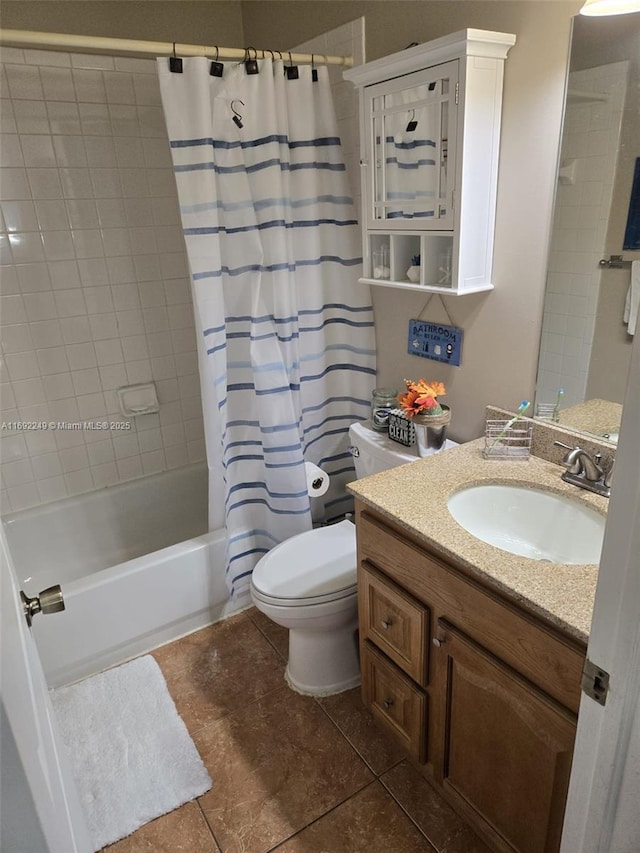 bathroom featuring shower / bath combo with shower curtain, tile patterned floors, toilet, and vanity