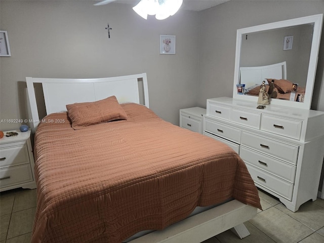 bedroom with light tile patterned floors