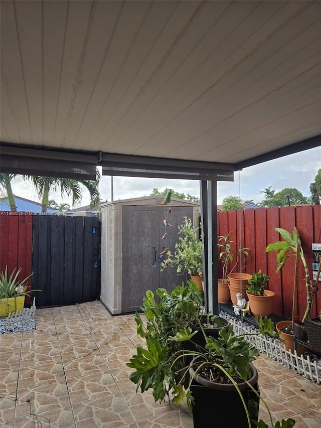 view of patio / terrace featuring a storage unit