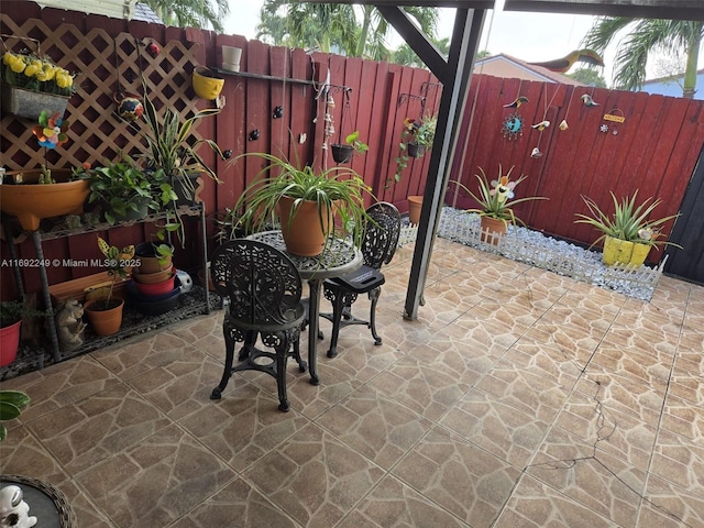 view of patio featuring fence
