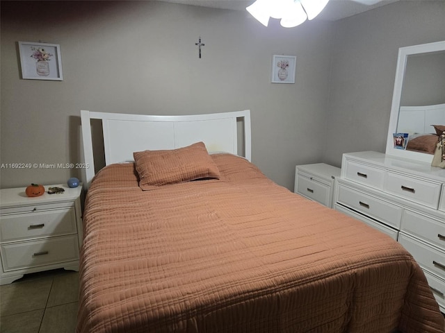 bedroom featuring dark tile patterned floors