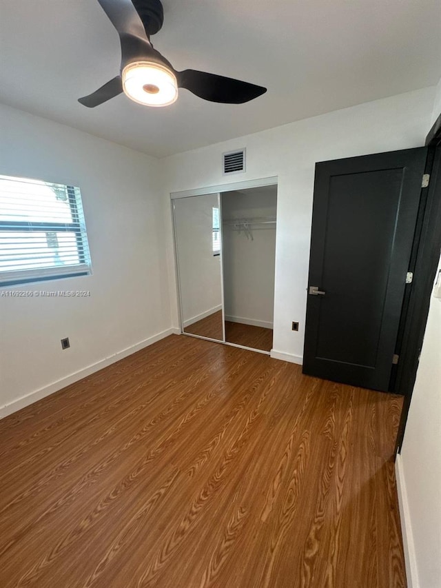 unfurnished bedroom with hardwood / wood-style flooring and ceiling fan