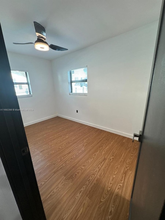 empty room featuring light hardwood / wood-style flooring and ceiling fan