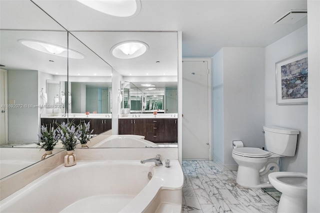 bathroom with vanity, a bidet, a tub to relax in, and toilet