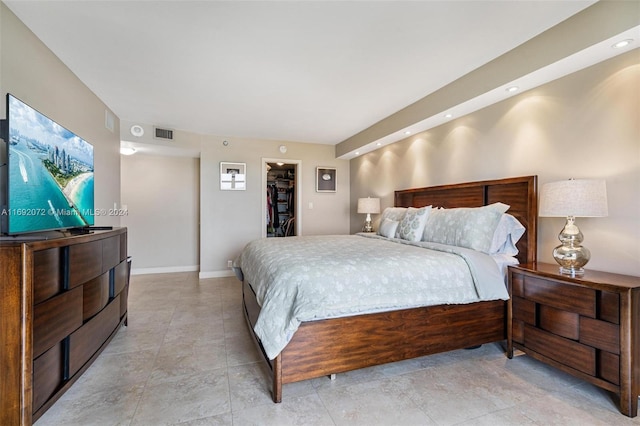 bedroom with a closet and a spacious closet