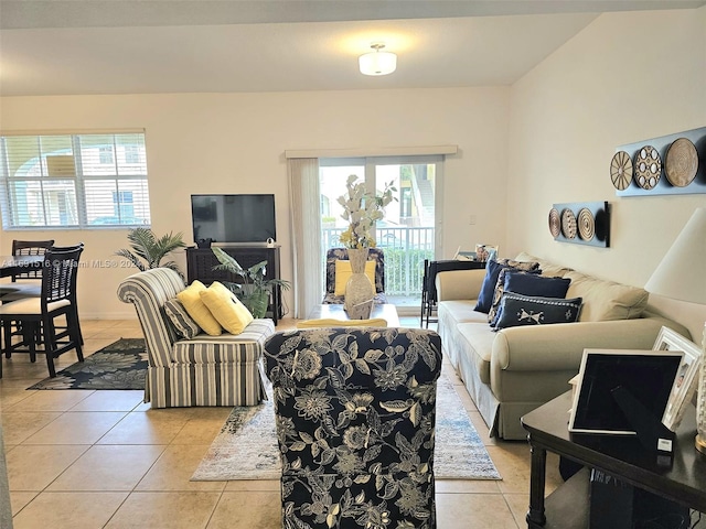 living room featuring plenty of natural light and light tile patterned floors