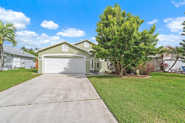 view of front facade with a front yard and a garage