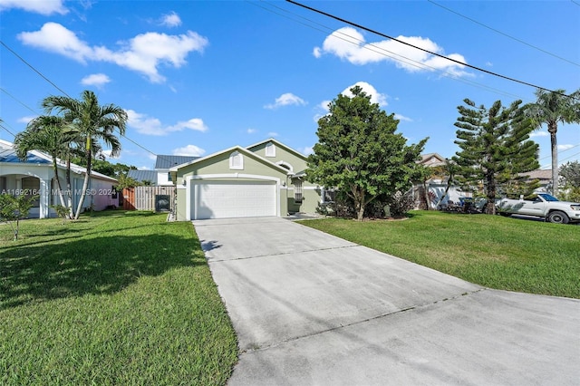 ranch-style home with a garage and a front lawn