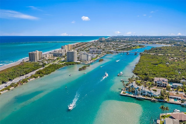 birds eye view of property featuring a water view and a view of the beach