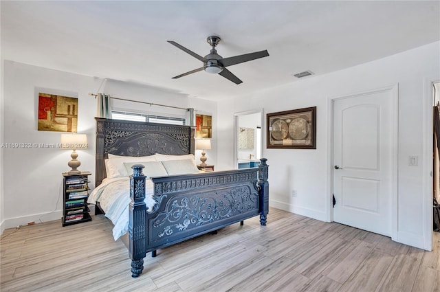 bedroom with ceiling fan and light wood-type flooring