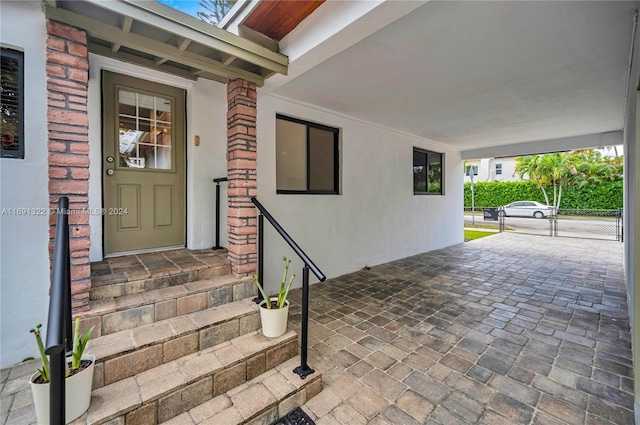 doorway to property with covered porch