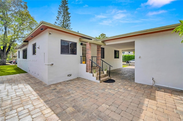 exterior space with a carport