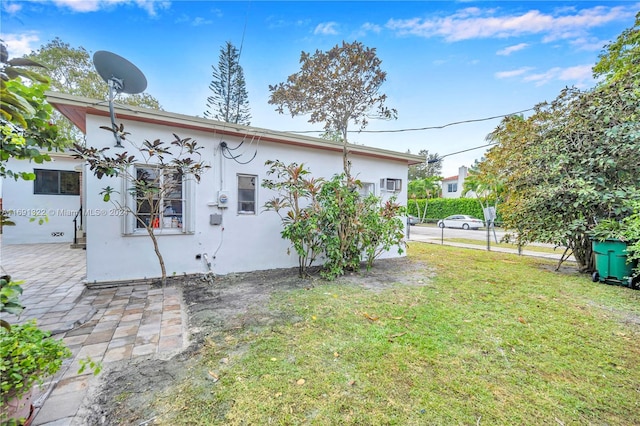 rear view of house with a lawn