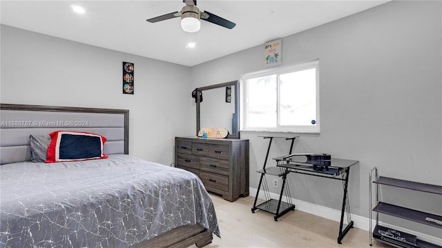 bedroom with light hardwood / wood-style flooring and ceiling fan