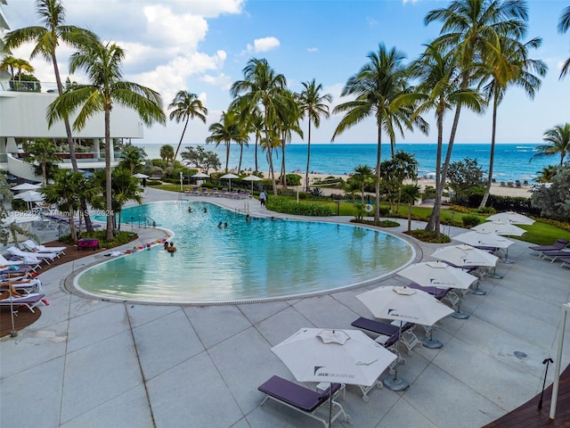 view of pool featuring a water view