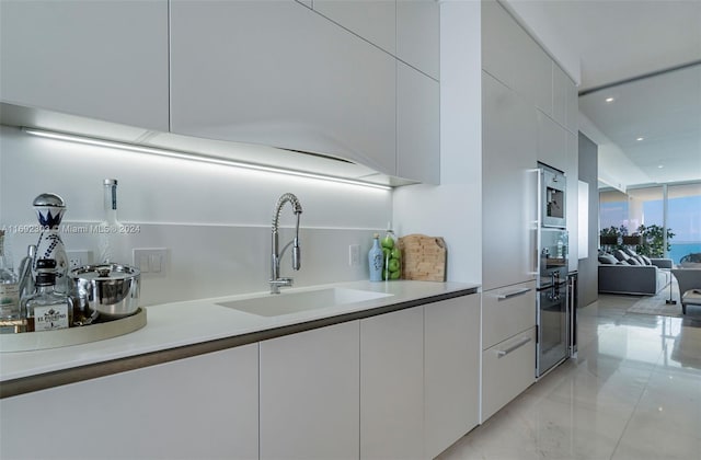 kitchen with sink and stainless steel oven