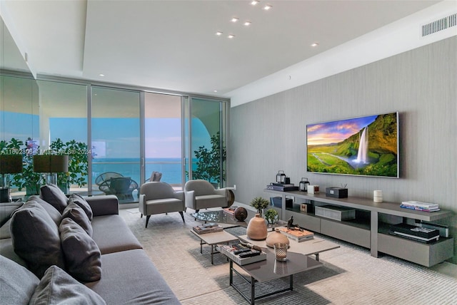 carpeted living room with floor to ceiling windows