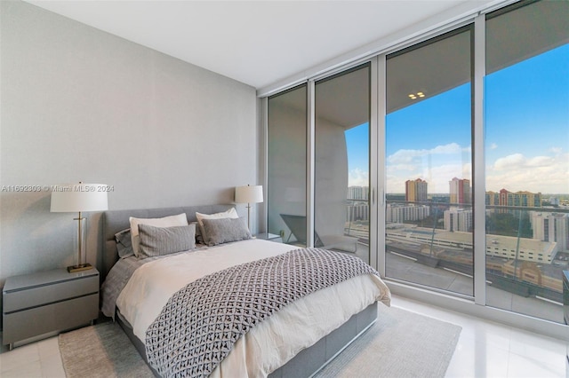 16901 Collins Ave Unit 1503, Sunny Isles Beach, FL 33160 - bedroom with a wall of windows, access to outside, light tile patterned floors, and a view of city