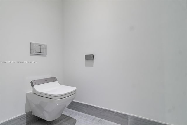 16901 Collins Ave Unit 1503, Sunny Isles Beach, FL 33160 - bathroom featuring baseboards and toilet